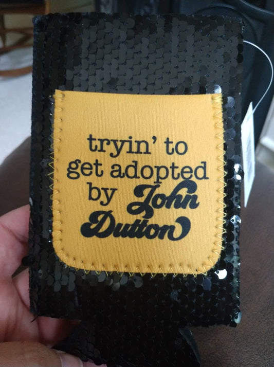 Slim Can Koozie - Tryin to get adopted by John Dutton